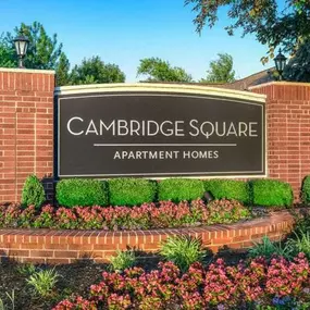 Lush landscaping surrounds you as you drive at Cambridge Square Apartments