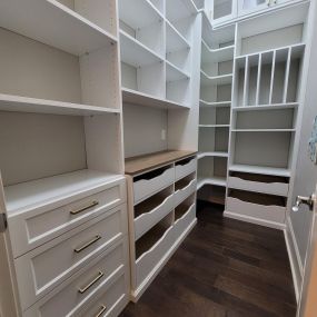 A pantry packed with storage! Vertical, pull outs, shelves and counterspace.