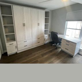 Dual duty room, office and guest room with the installation of a wall bed and built in desk.