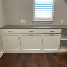 Folding station and storage for this laundry room.