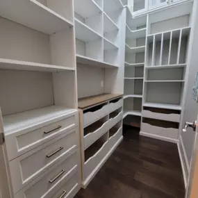 A pantry packed with storage! Vertical, pull outs, shelves and counterspace.