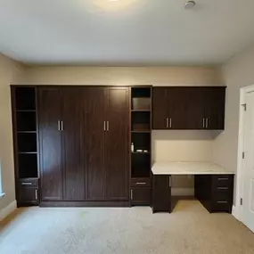 Murphy beds don't have to look like a bed. When not in use, we can cleverly disguise them as custom storage to suit your home office.