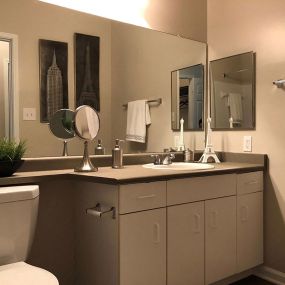 Relax after a long day in your bathroom with garden tub, unique cabinets, LED lighting at Autumn Park Apartments