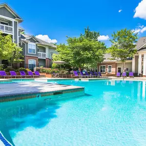 Two Sparkling Swimming Pools with Expansive Sundecks, Lounge Chairs, Umbrellas and Relaxing Courtyard at Autumn Park Apartments