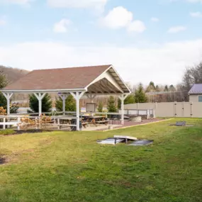 STR Behavioral Health Silver Pines: Exterior photo of our  addiction and mental health treatment center's patio area for  lounge and rec activities.