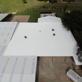 Our team installed a metal restoration system on this commercial metal roof!