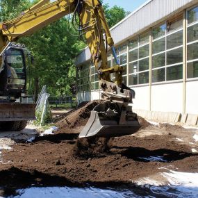 Tractor digging at a construction site