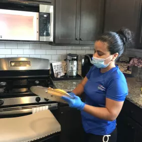 Meticulous attention to detail as we carefully clean and disinfect your kitchen surfaces, creating a pristine cooking environment.