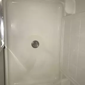 Sparkling clean shower after our thorough cleaning service, removing all buildup and grime for a fresh look.