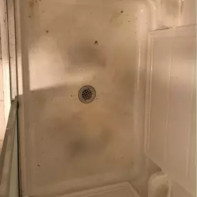 Shower before our deep cleaning—demonstrating the powerful transformation ATL Clean brings to your home's toughest cleaning challenges.