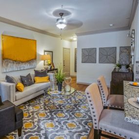 Living Room With Kitchen View at The Aster Sugar Land Apartments, Sugar Land