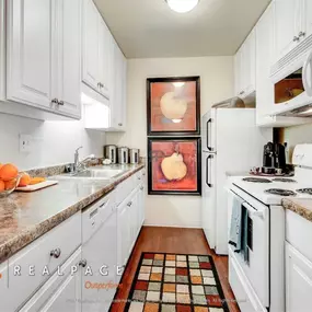White kitchen with granite countertops