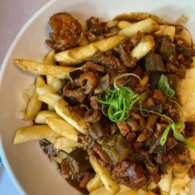 Gumbo fries exclusively available on our happy hour menu