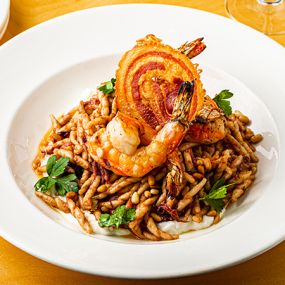 Grilled Shrimp and Trofie Pasta  with Radicchio pesto, pancetta, red wine braised onions, whipped ricotta, toasted pine nuts