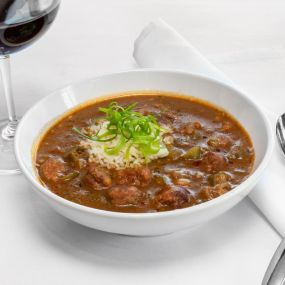 Louisana Crawfish Gumbo with gulf shrimp, smoked andouille sausage, rice, scallions