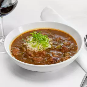 Louisana Crawfish Gumbo with gulf shrimp, smoked andouille sausage, rice, scallions