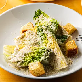 Jax Caesar Salad with ittle gems, croutons, whole grain mustard dressing, grana padano