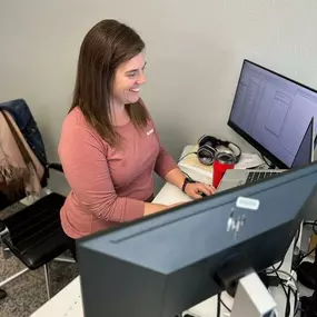 Myra hard at work with a smile on her face! ????Did you know we all stand up desks(with the option to lower of course to a standard size) in our new additional office space?