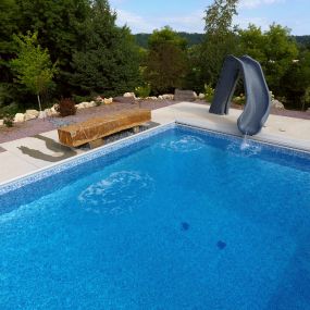 Transform your pool deck into a stunning oasis with our professional pool landscaping solutions in Rochester, MN. Explore the possibilities of incorporating a water fountain today!