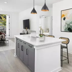 Kitchen Islands Include Additional Storage Space and Pendant Lighting