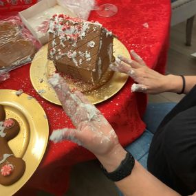 The team had a blast making and decorating gingerbread houses!