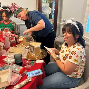 The team had a blast making and decorating gingerbread houses!