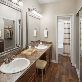 Bathroom with two sinks and vanity at Camden Addison apartments in Addison, Tx