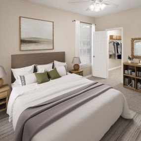 Bedroom with carpet and walk-in closet at Camden Addison apartments in Addison, Tx