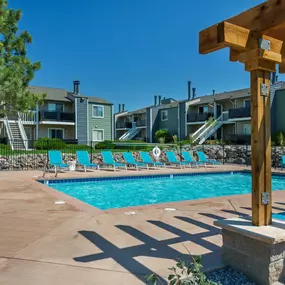 Swimming Pool Area With Shaded Chairs