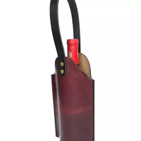 Whether you include this adorable wine tote carrier in your gift, or just use it to carry your hostess gift into the party in style, either way this one is a real winner. Gorgeous single piece of leather construction with a sturdy handle long enough for you to slip it onto your arm when your hands are full carrying in that cake (or watermelon). 

Space saving design stores flat when not in use. And like everything else, designed and handmade right here on Orcas Island.