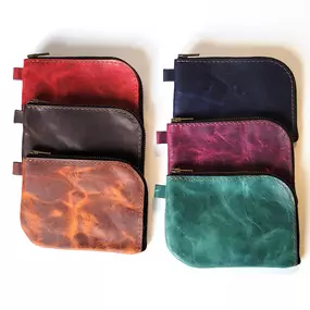 This zippered pouch is adorable, useful, and will keep looking better with age! The zipper conveniently and attractively turns the corner so you can more easily access all your things. Use anywhere and everywhere, makes an awesome gift!