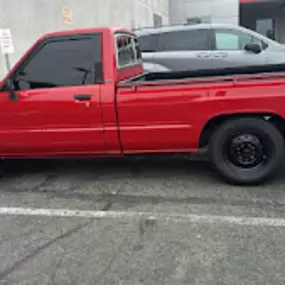 CARLITOS AUTO BODY & REPAIR SERVICE red toyota truck