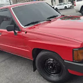 CARLITOS AUTO BODY & REPAIR SERVICE red toyota truck