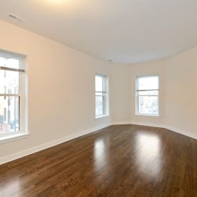 Empty Living Room with Hardwood Floor and Windows