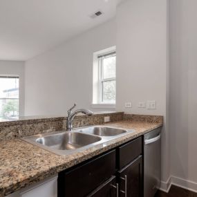 Kitchen inside with overview of living room