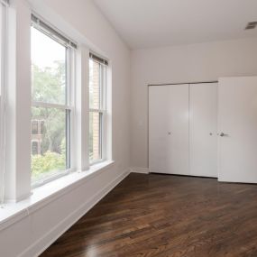 Hallway to coat closet and doorway