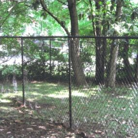 backyard aluminum chain link fence installation by Pro-Line Fence Co.