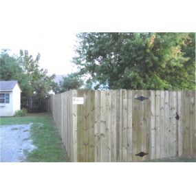 newly installed privacy fence with gate by Pro-Line Fence Co.