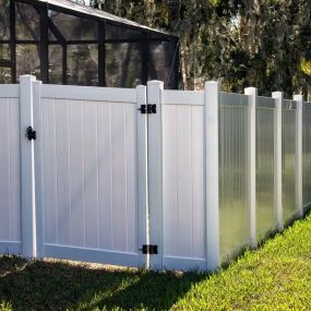 painted white wooden privacy fence with gate by Pro-Line Fence Co.