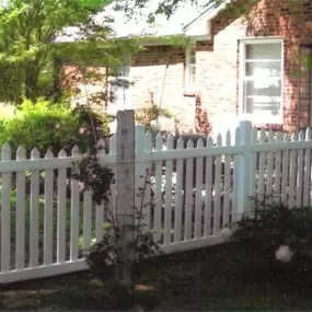 white picket fence by Pro-Line Fence Co.