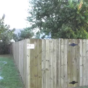 newly installed privacy fence with gate by Pro-Line Fence Co.