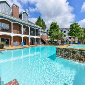 Resort Style Pool with Soothing Waterfall Features and Sundeck with Poolside Wi-Fi Access at Sugarloaf Crossing Apartments