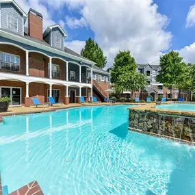 Resort Style Pool with Soothing Waterfall Features and Sundeck with Poolside Wi-Fi Access at Sugarloaf Crossing Apartments