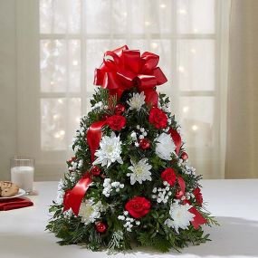 Holiday Flower Tree - EXCLUSIVE You’ve never seen a Christmas tree quite like this! Our best selling holiday arrangement has been a favorite of customers for years, especially because of its compact size, which fits perfectly into small spaces.
