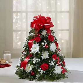 Holiday Flower Tree - EXCLUSIVE You’ve never seen a Christmas tree quite like this! Our best selling holiday arrangement has been a favorite of customers for years, especially because of its compact size, which fits perfectly into small spaces.