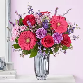 A romantic gift for your one-and-only. Our stunning arrangement showcases vibrant pink and purple blooms. Gathered in a silver vase, this must-send surprise leaves no doubt how you feel in your heart.