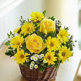 Whatever it is you're trying to say, do it with this bright and beautiful bouquet! A mix of roses, lilies, daisy poms and more is hand-gathered inside a charming basket to send along your best wishes for a happy birthday, a speedy recoveryâ€¦ any sentiment under the sun!