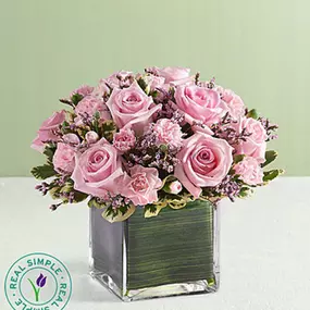 EXCLUSIVE We’re delighted to present our new spring arrangement, brought to you exclusively through our partnership with Real Simple®! Both feminine and fabulous, this compact creation flaunts an array of all-pink blooms, including roses, mini carnations and limonium. Artistically hand-designed inside a modern cube vase lined with Ti leaf ribbon, it’s a gorgeous surprise that will look just as charming in someone else’s space as it will in yours!