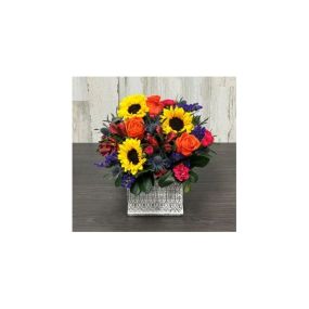 Spring Sensation - Bold and Beautiful! This bright colored arrangement is sure to make Mom smile! Our designers have created a unique combination of flowers in a white-washed cement container! Mom will love our sunflowers surrounded by blue thistle, mini carnations, Peruvian Lilies and roses! *Note that some flowers may arrive in bud-form so they will last even longer! Since this unique gift is hand-crafted by our talented designers, the flower varieties and colors may vary based on local availa