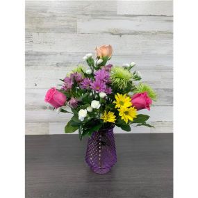 Looking to send someone a little joy? We’ve got the perfect mixed floral arrangement for you! These colorful blooms will put a smile on anyone’s face! No matter what your occasion, we guarantee they will bring a little joy to someone special! We strive to send the freshest flowers so to ensure lasting beauty, some flowers may arrive in bud form and will fully bloom over a few days. The benefit is that they will last longer for the recipient to enjoy! Vase color may vary based on local availabili